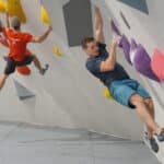 Two men bouldering on a wall in Easton
